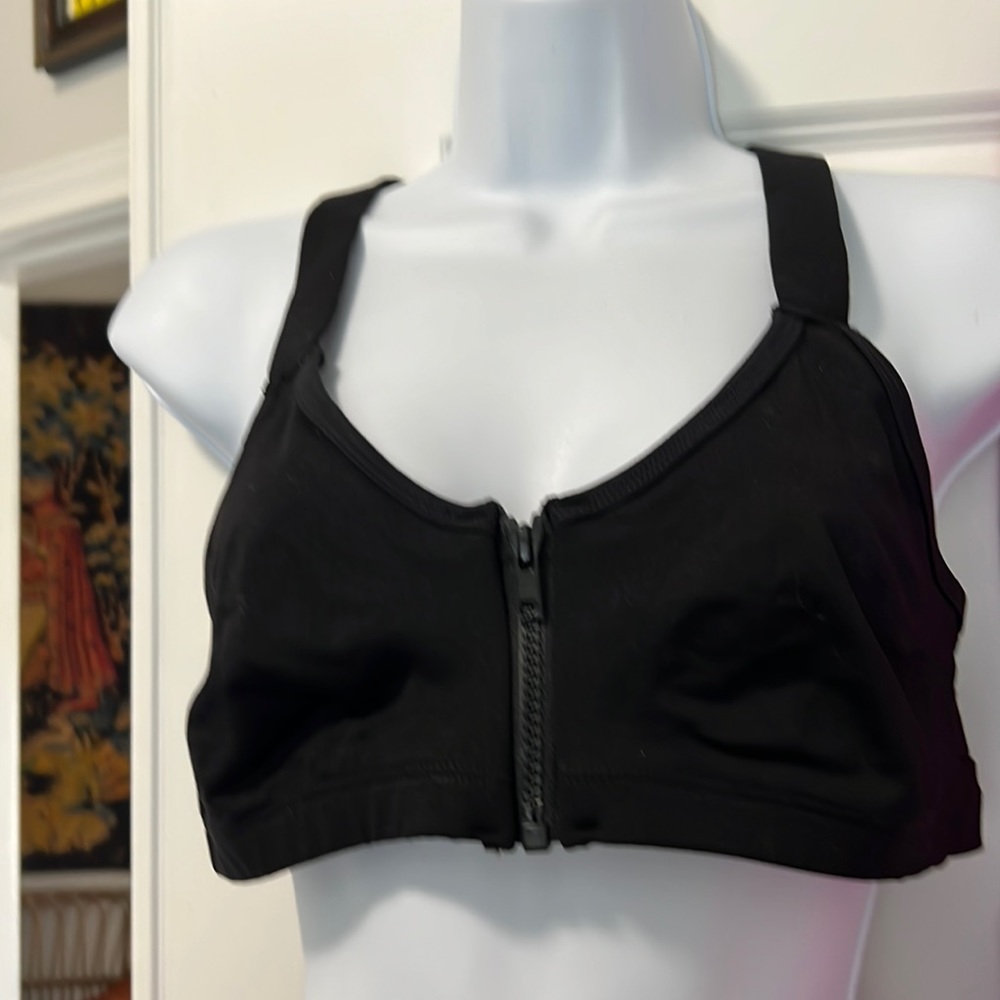 Athletic zip front top with keyhole back detail.